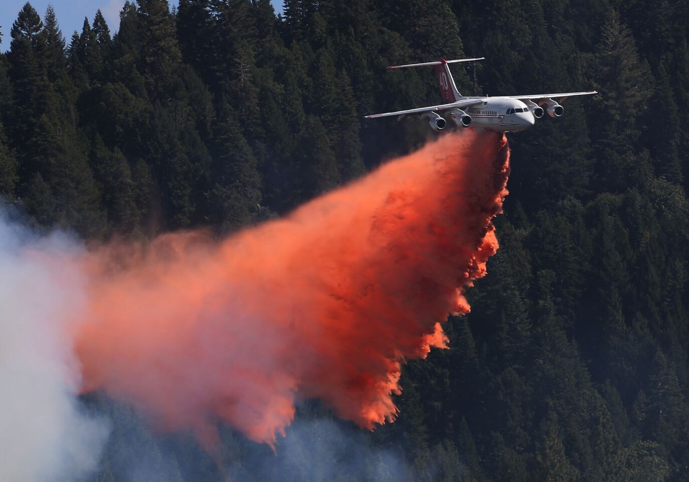 An aerial tanker drops fire retardant on the King fire near Pollock Pines, Calif., on Sept. 15.