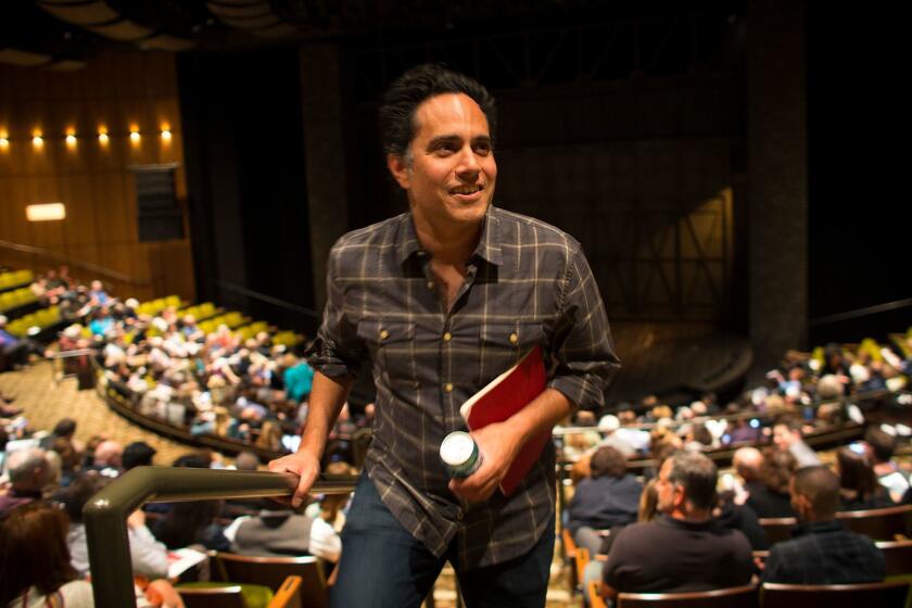 LOS ANGELES, CA - APRIL 25, 2017 : Playwright Rajiv Joseph walks back to his seat after intermission on opening night of a preview performance for his new play "Archduke" on April 25, 2017 at the Mark Taper Theatre in Los Angeles, California.(Gina Ferazzi / Los Angeles Times)