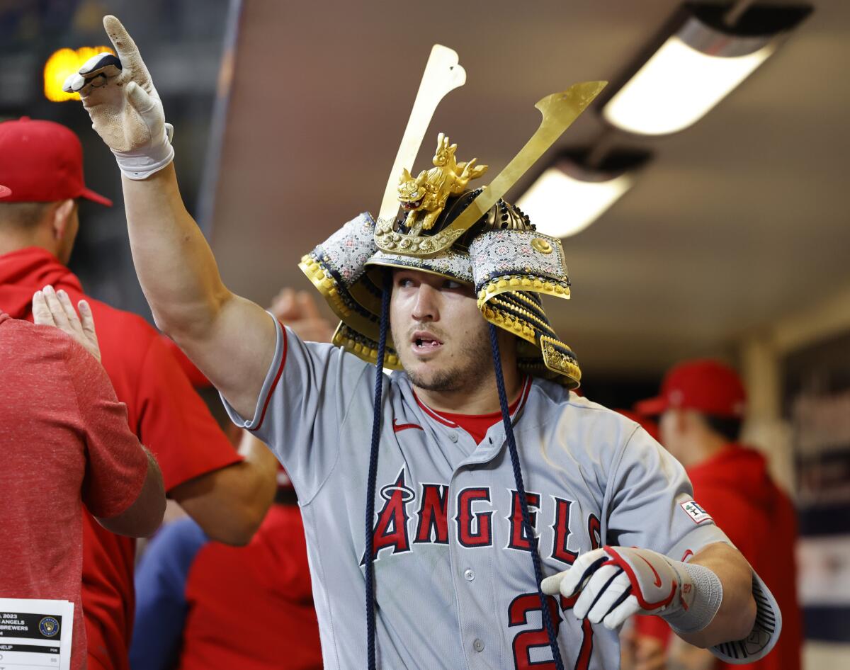 The Angels' Mike Trout reacts in the dugout after his two-run home run in the ninth inning April 29, 2023.