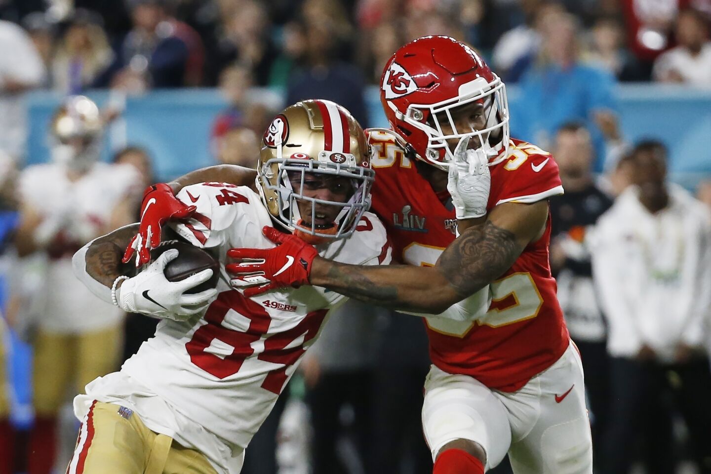 San Francisco 49ers wide receiver Kendrick Bourne tries to fend off against Kansas City Chiefs cornerback Charvarius Ward during the second half of Super Bowl LIV.