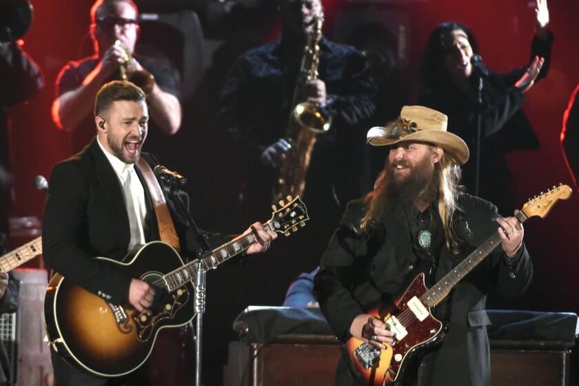 Justin Timberlake, left, and Chris Stapleton perform Wednesday at the 49th annual CMA Awards in Nashville.
