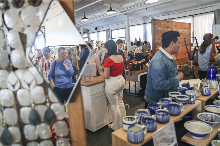 SAN DIEGO, CA-NOV 12: visitors check out the booths at the San Diego Hand Made Market on Sunday, November 12, 2022 in the Midway District near Downtown San Diego, (Sandy Huffaker for The San Diego Union Tribune)