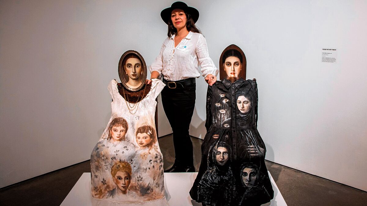 Alexandra Dillon with ‘Two Mothers,’ one more benign, one darker, representing the grandmothers and mothers who came before us; on exhibit at Oceanside Museum of Art
