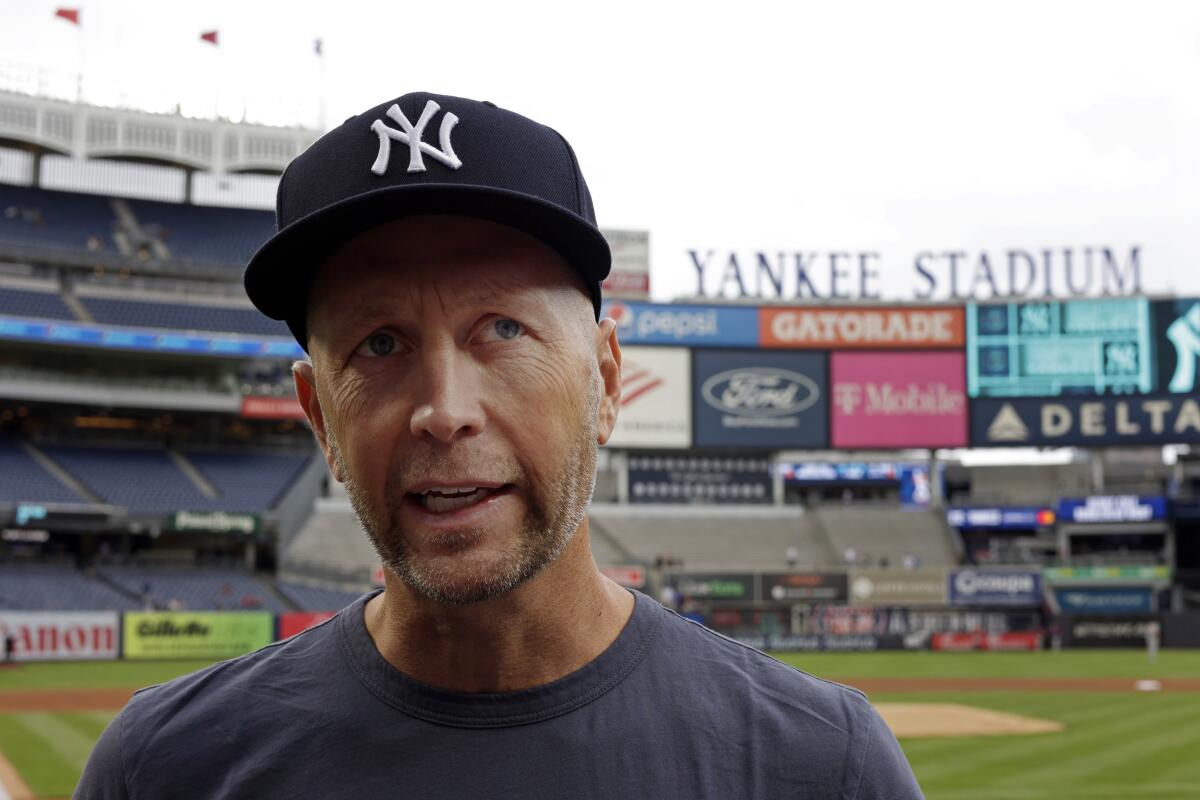 U.S. men's national soccer team head coach Gregg Berhalter speaks to reporters before the first baseball game of a doubleheader between the Minnesota Twins and the New York Yankees on Wednesday, Sept. 7, 2022, in New York. (AP Photo/Adam Hunger)