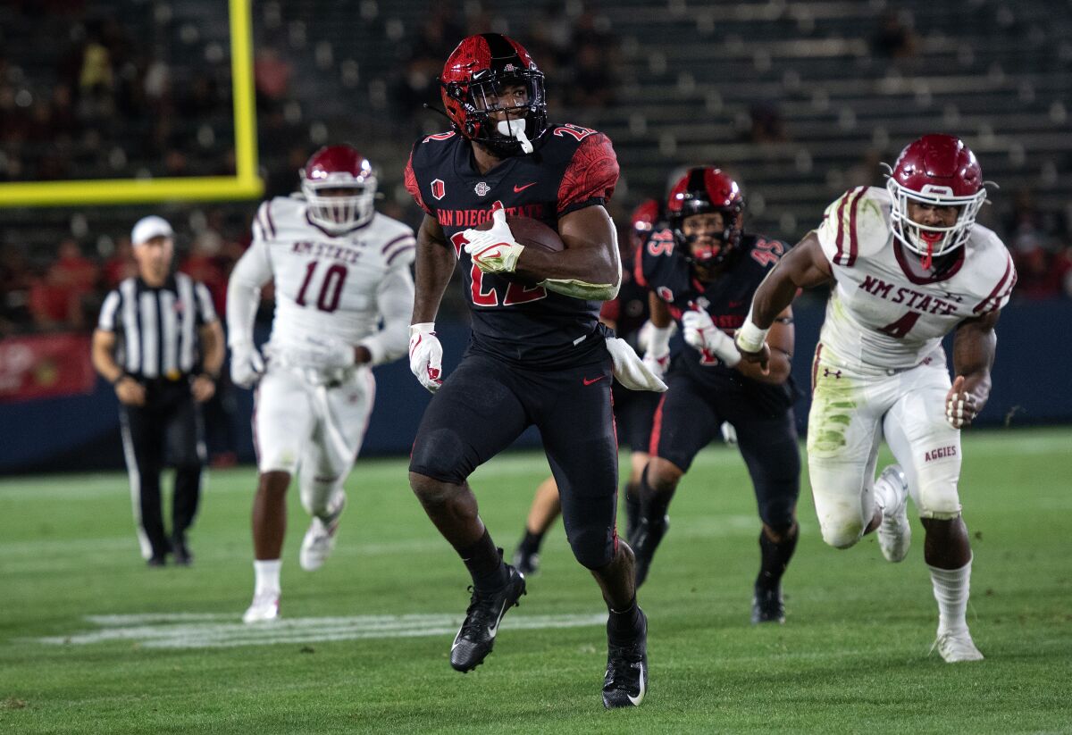 SDSU running back Greg Bell scores during 28-10 win over New Mexico State at Dignity Health Sport Park in Carson on Saturday.