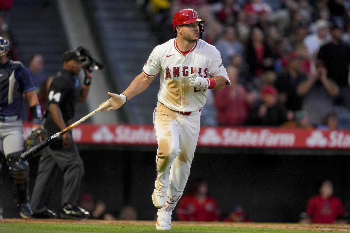 Angels star Mike Trout tosses his bat after hitting a home run during the third inning of a 7-1 win over the Tampa Bay Rays.