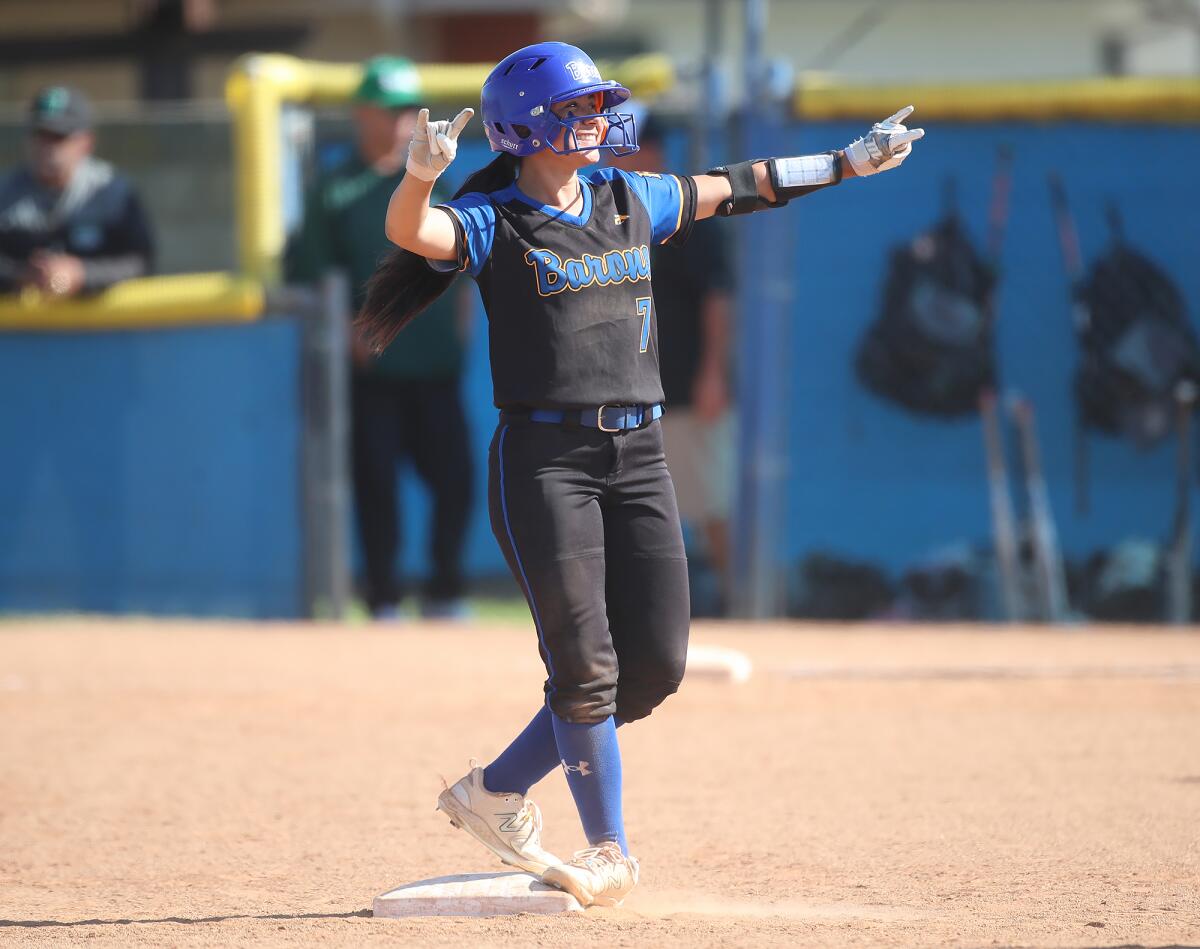 Fountain Valley's Marissa Sardinas (7) happily reaches second base on a double against Upland on Tuesday.