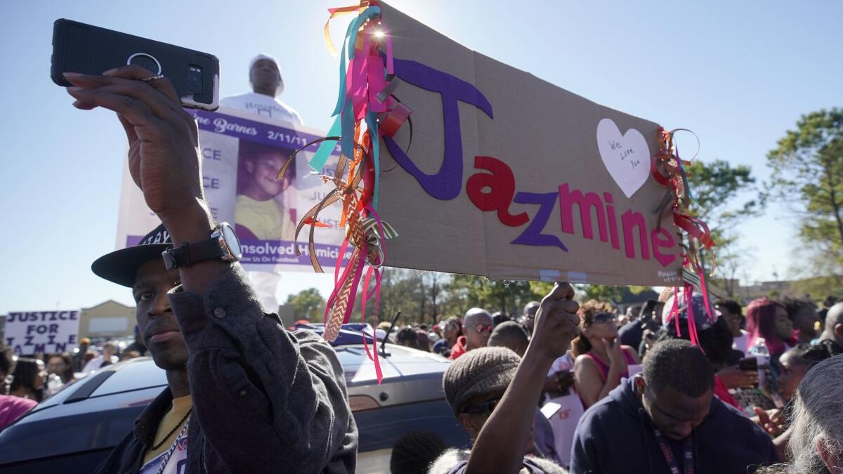 People rally on East Sam Houston Parkway in Houston in memory of Jazmine Barnes.