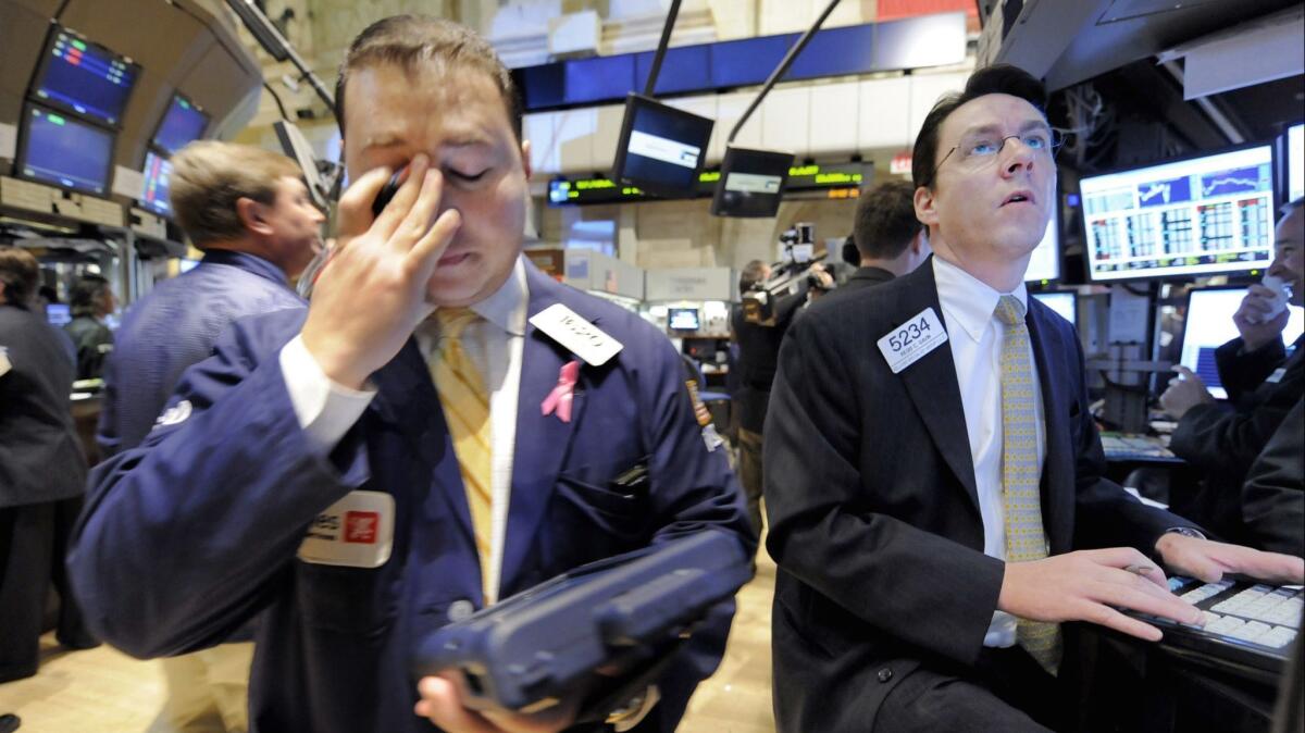 Traders work on the floor of the New York Stock Exchange on Oct. 23, 2008.