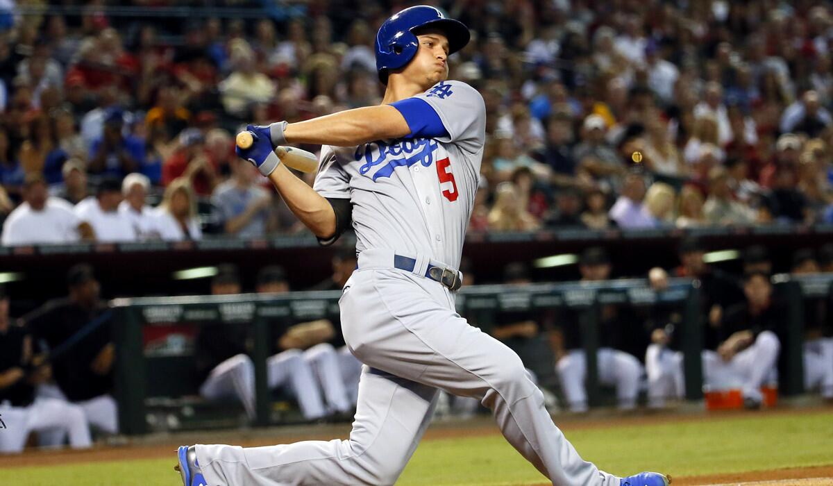 Dodgers shortstop Corey Seager bats against the Arizona Diamondbacks during the first inning on Saturday.