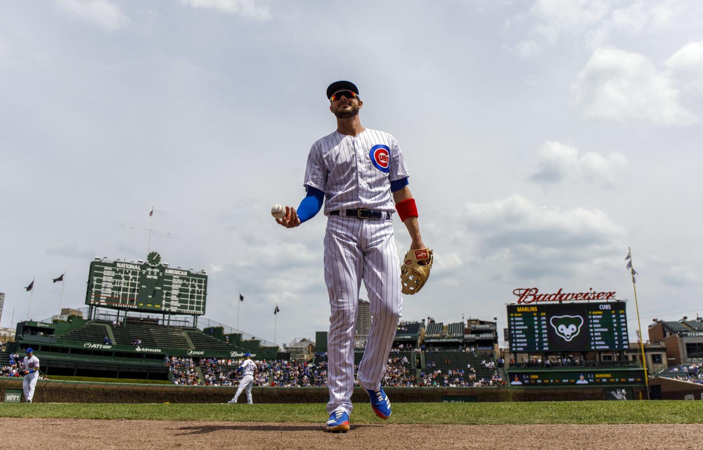 Cubs third baseman Kris Bryant tosses a ball to a fan before a game Wednesday, May 9, 2018 at Wrigley Field.