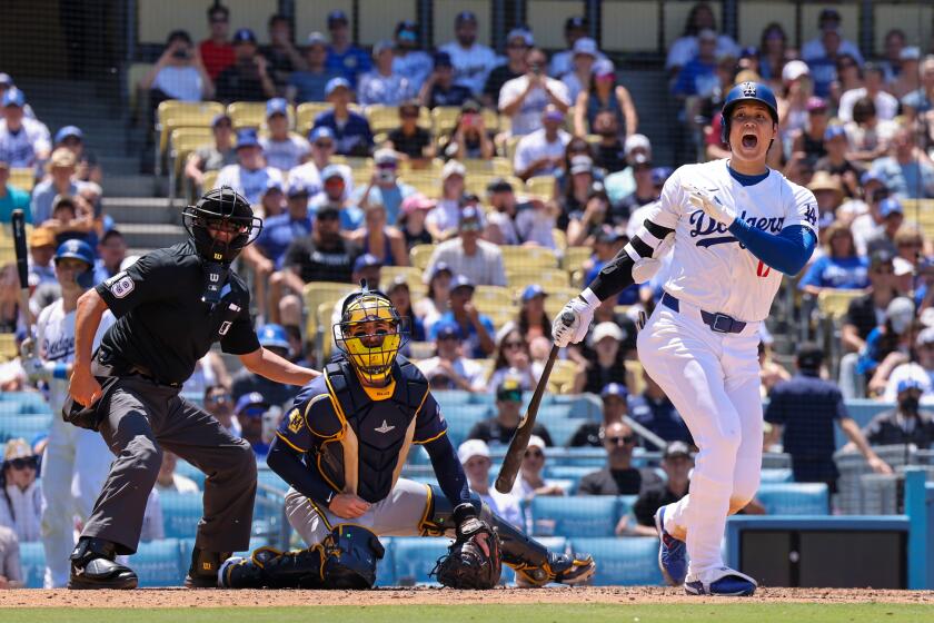 Los Angeles, CA, Sunday, July 7, 2024 - Los Angeles Dodgers two-way player Shohei Ohtani (17) yells out to warn people in foul territory as he fouls a pitch off in the 4th inning against the Milwaukee Brewers at Dodger Stadium. (Robert Gauthier/Los Angeles Times)