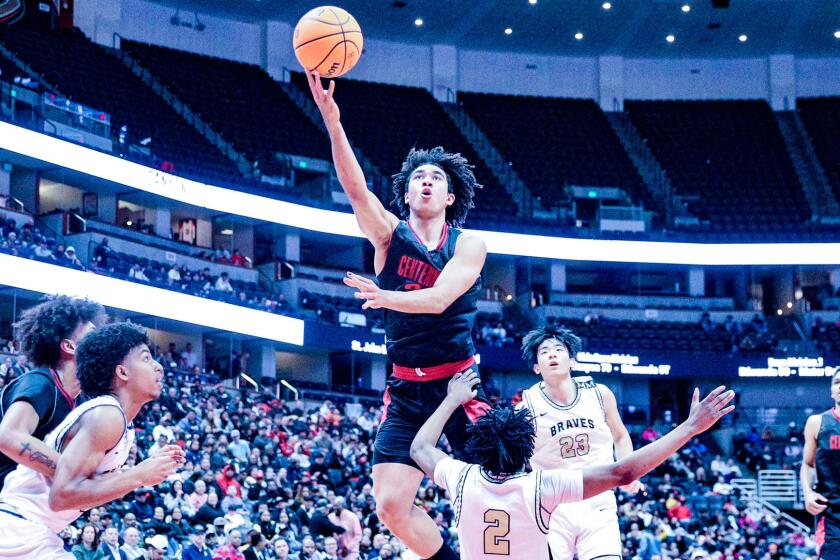 Jared McCain of Corona Centennial goes up against St. John Bosco's Amiri Meadows in Open Division final at H