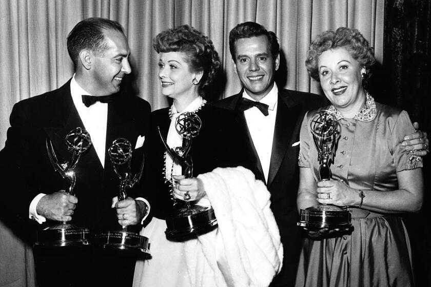 Harry Ackerman, Lucille Ball, Desi Arnaz and Vivian Vance at the Emmy Awards. (TVA / PictureGroup / Invision / AP)