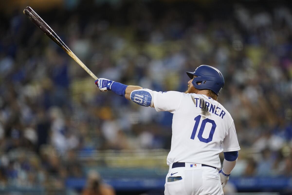 The Dodgers' Justin Turner watches his three-run home run during the first inning Oct. 2, 2021.