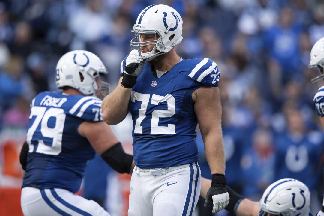 Indianapolis Colts tackle Braden Smith walks back to the huddle.