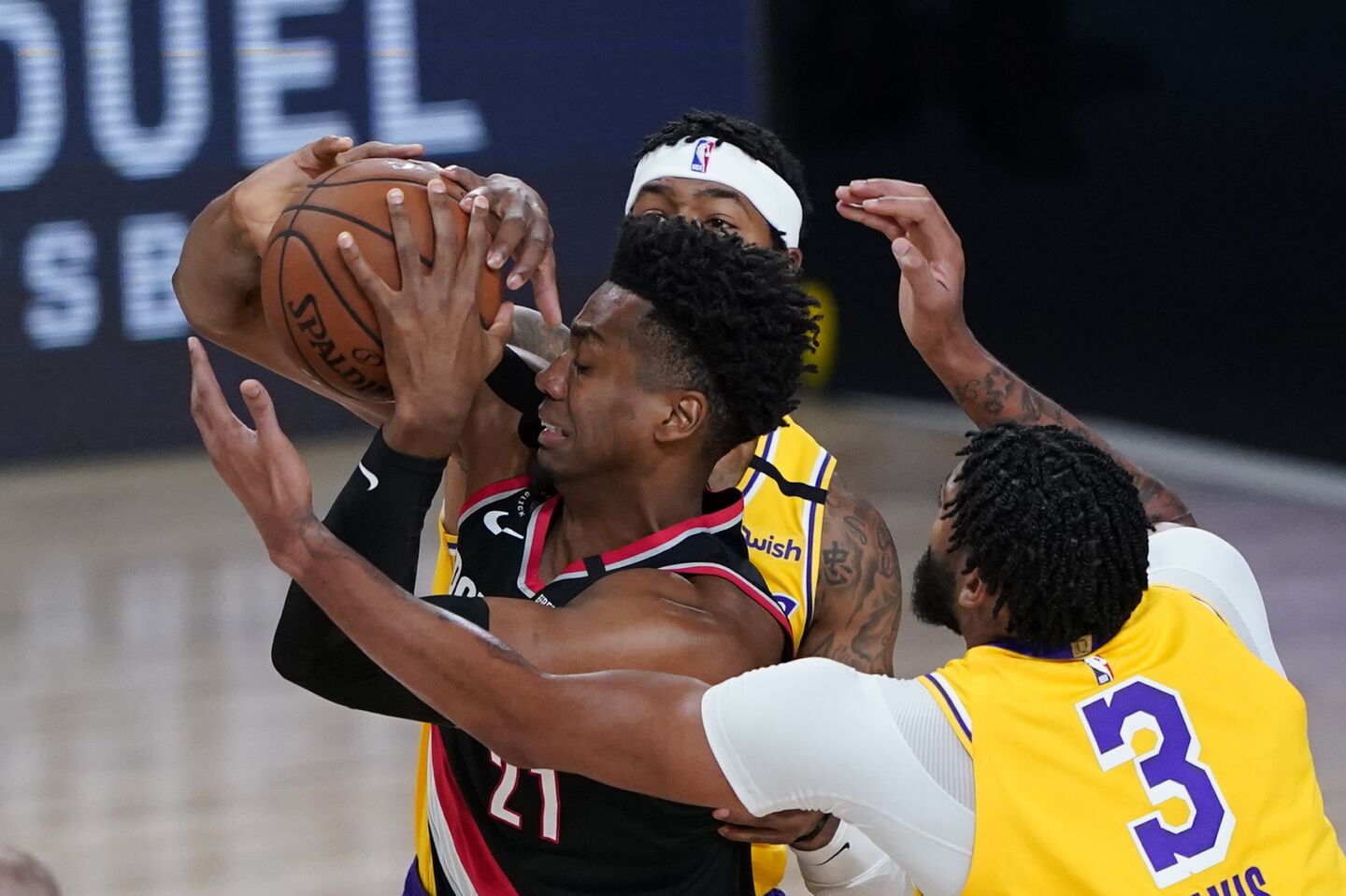 Lakers forward Anthony Davis, right, defends against Portland Trail Blazers center Hassan Whiteside during the first half.