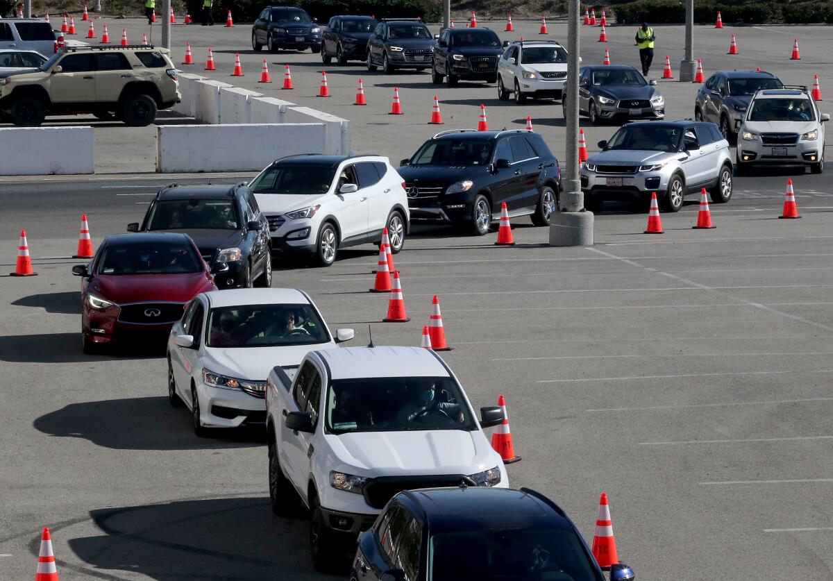 Cars lined up in January 2021 at a COVID-19 vaccination site at the Long Beach Convention Center.