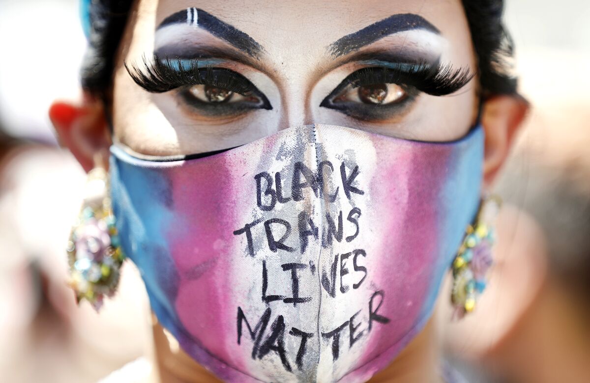 Jason De Puy of West Hollywood wears a face mask that reads "Black Trans Lives Matter" 