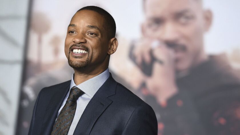 Disney's first-look photos of "Aladdin" show Will Smith in character as the film's genie.