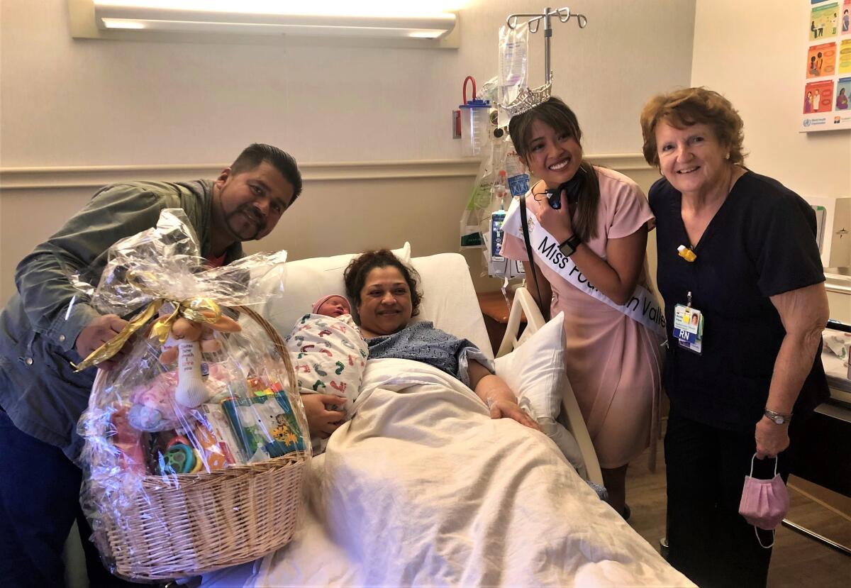 Patricia Santos and Jorge Vialla, Miss Fountain Valley Maaikee Pronda and nurse Dorothy Wilson with baby Sara Rose.