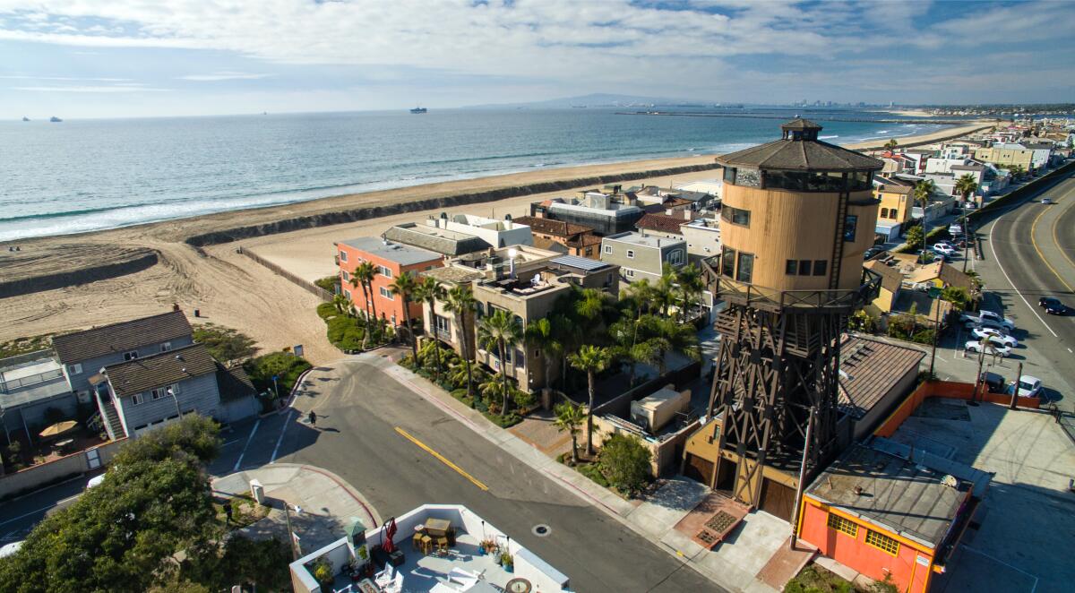 A 1890s water tower in Sunset Beach that was converted to a home sits near the beach.