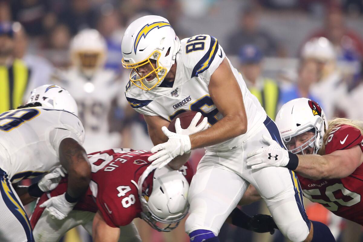 Chargers tight end Hunter Henry carries the ball during a preseason game against the Arizona Cardinals on Aug. 8.