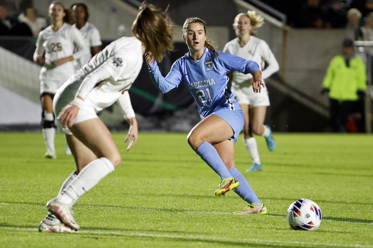 FILE - North Carolina's Ally Sentnor (21) passes the ball during the first half of the team's NCAA College Cup.