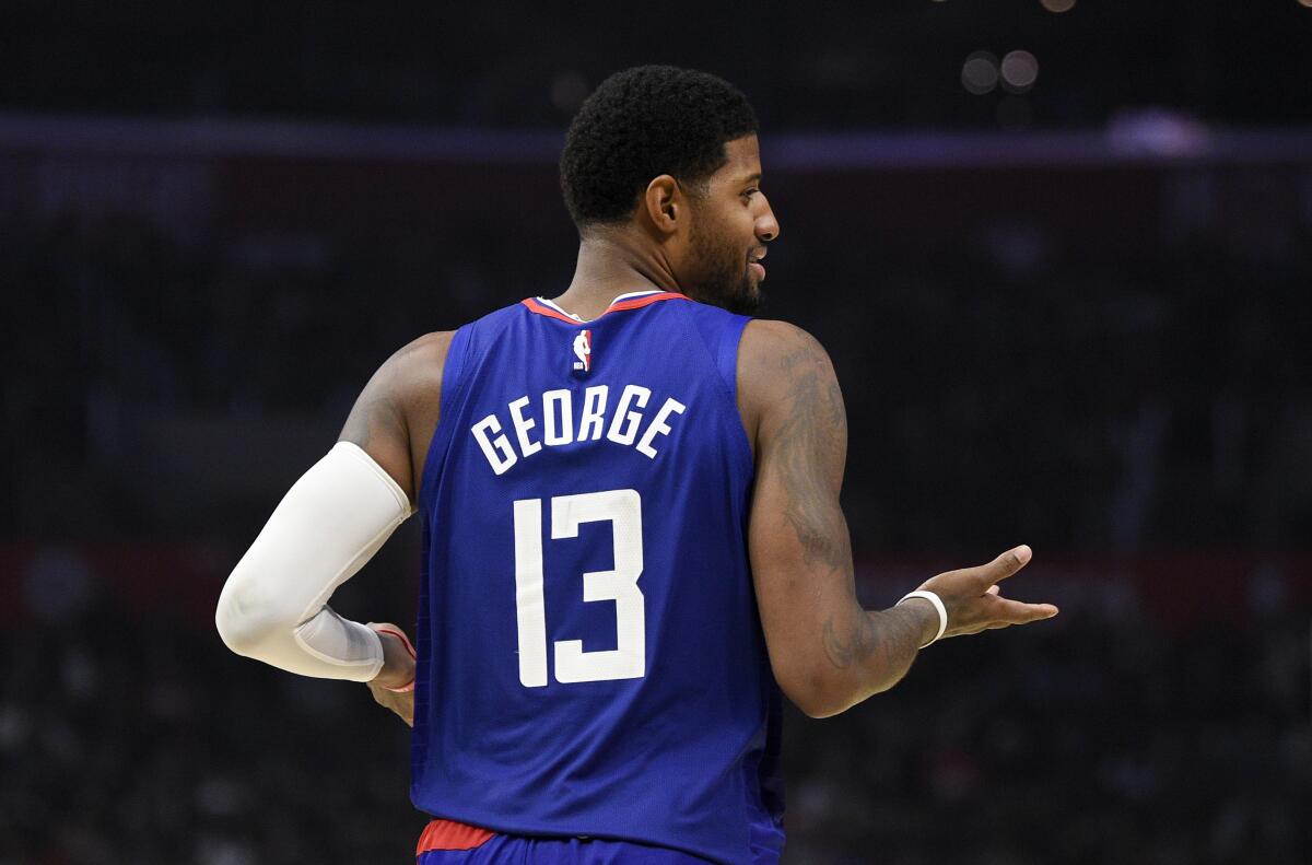 Clippers forward Paul George gives a shrug to his teammates on the bench during another proficient performance on Nov. 16, 2019, against the Atlanta Hawks.