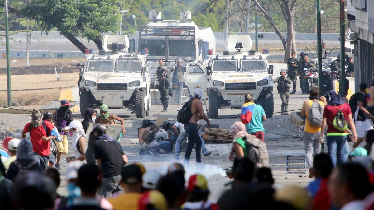 The Venezuelan national guard throws tear gas toward pro-Juan Guaido demonstrators after a May 1 demonstration at Plaza Altamira on May 1 in Caracas, Venezuela.