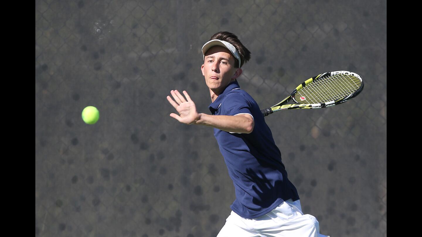 Newport's Andy Myers runs down a forehand in his match with Sage Hill's Ian Huang during boy's nonleague tennis action on Thursday.