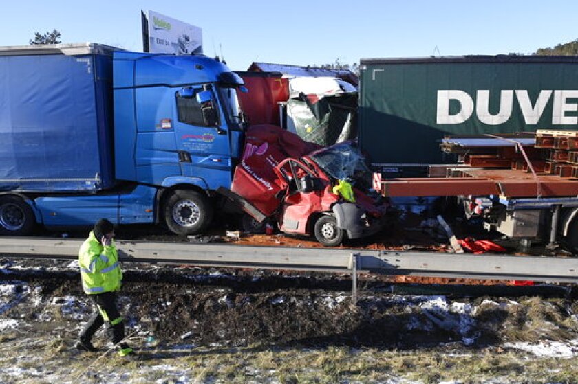 Six people were injured in a crash of 36 vehicles on a highway D5 near Zebrak in Beroun Region, Czech Republic, on Thursday, Jan. 20, 2022. The police is investigating the cause of the accident, bad weather is being taken into account. (Ondrej Deml / CTK via AP).