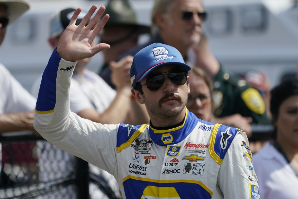 Chase Elliott waves prior to a NASCAR Cup race at New Hampshire Motor Speedway on July 17.