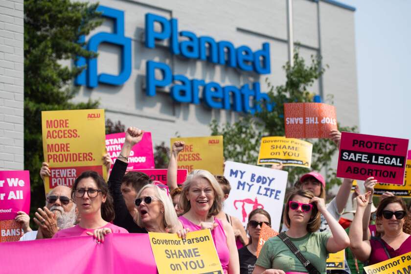 (FILES) In this file photo taken on May 31, 2019, Pro-choice supporters and staff of Planned Parenthood hold a rally outside the Planned Parenthood Reproductive Health Services Center in St. Louis, Missouri. - The Missouri state health department on June 21, 2019, denied a license to the only abortion clinic in the midwestern US state, but it will remain open pending a court ruling. The denial of the license was announced by Planned Parenthood, which operates the abortion clinic in the city of St. Louis. "Missouri's health department weaponized a regulatory process to deny an abortion license to the last remaining health center in Missouri that provides abortion," Planned Parenthood said in a tweet. (Photo by SAUL LOEB / AFP)SAUL LOEB/AFP/Getty Images ** OUTS - ELSENT, FPG, CM - OUTS * NM, PH, VA if sourced by CT, LA or MoD **