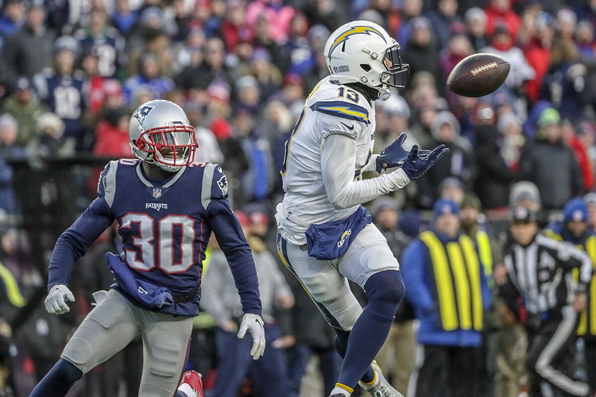Chargers wide receiver Keenan Allen catches a 32-yard pass in front of New England Patriots defensive back Jason McCourty.