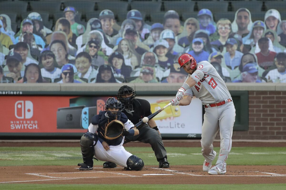Angels' Mike Trout hits a solo home run during the first inning of a game against Seattle. 
