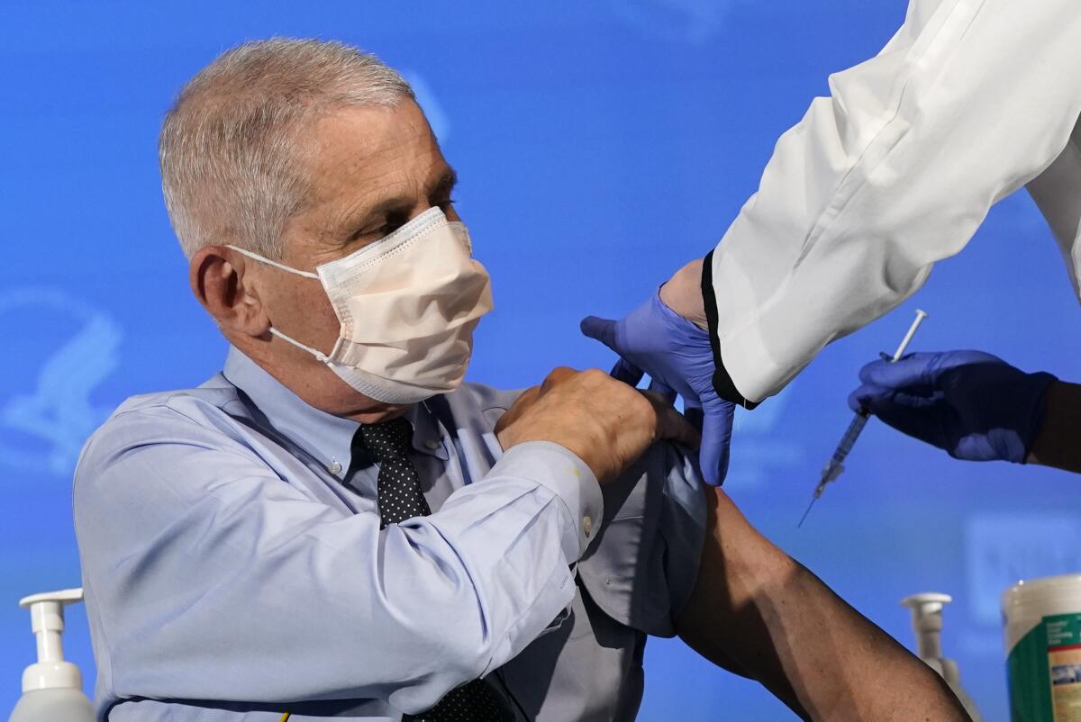 Dr. Anthony Fauci prepares to receive his first dose of Moderna's COVID-19 vaccine on Dec. 22. 