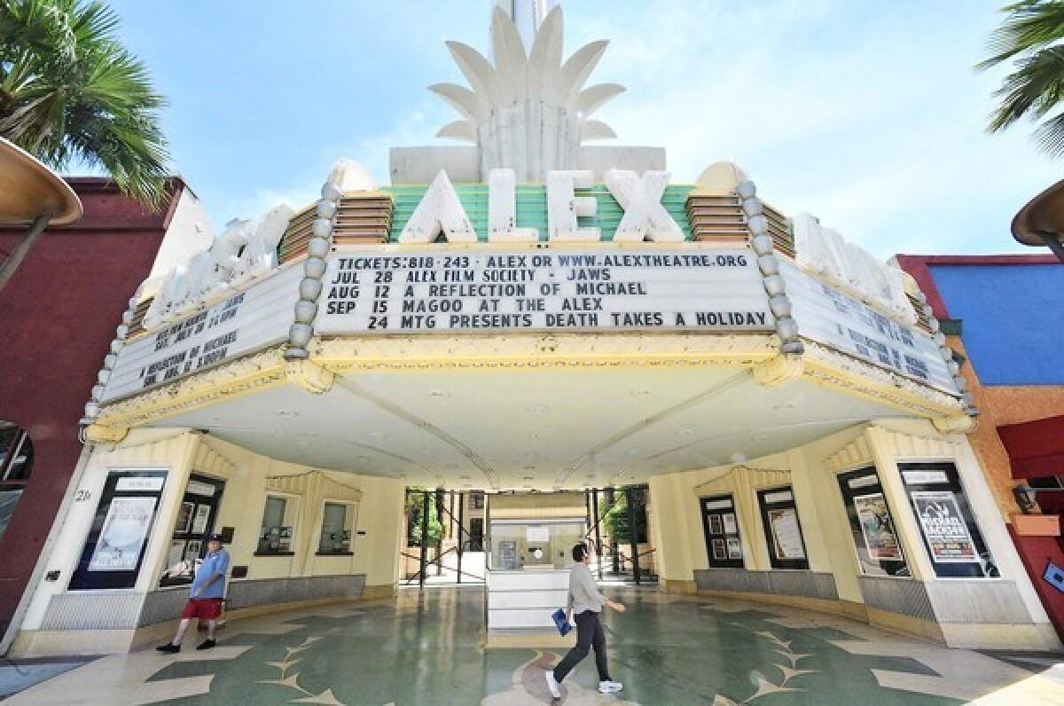 Pedestrians walk past the Alex Theatre on Tuesday, July 10, 2012. The public was invited to explore the Alex Theatre on Sunday, June 30, and take a last look before big changes are made to the building's south and western sides.