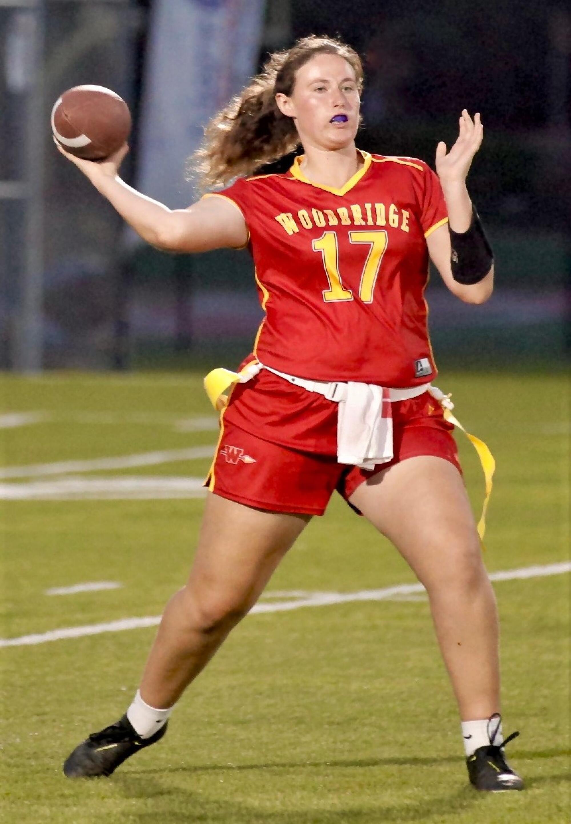 Woodbridge quarterback Teagan Burrus sets up to deliver a pass.