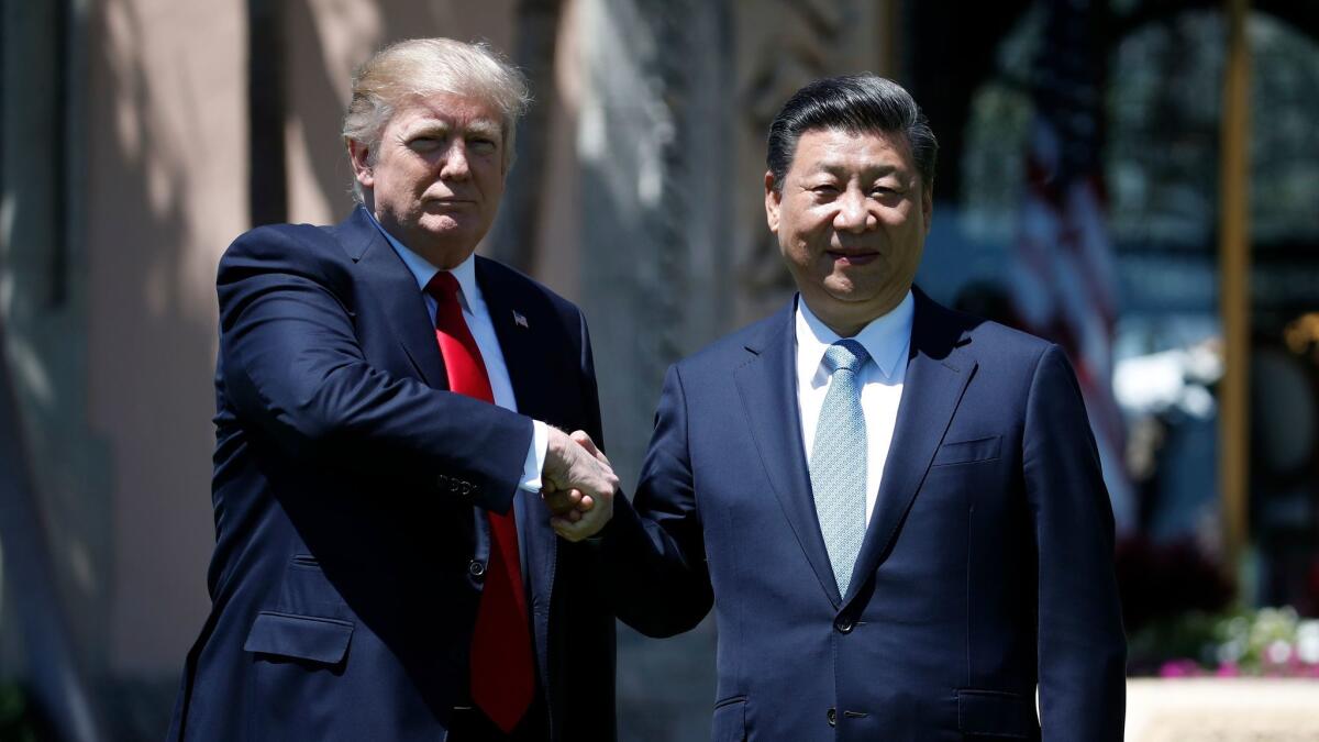 President Donald Trump and Chinese President Xi Jinping shake hands after a bilateral meeting at Mar-a-Lago in Palm Beach, Fla. on April 7, where the two discussed the nuclear weapons program of China's ally, North Korea.