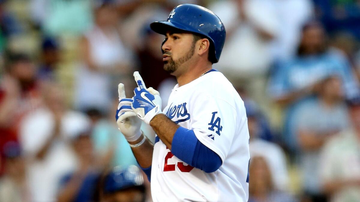 Dodgers first baseman Adrian Gonzalez celebrates as he crosses home plate after hitting a solo home run against the Mets in the second inning Friday night at Dodger Stadium.