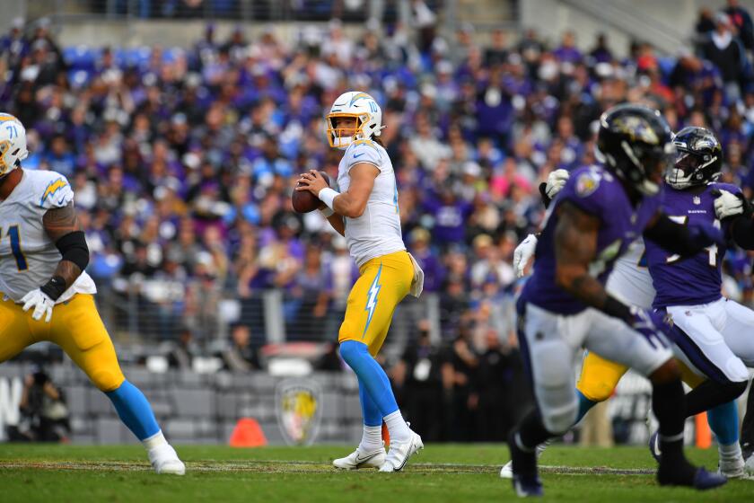 Chargers quarterback Justin Herbert looks to pass against the Baltimore Ravens on Oct. 17, 2021.