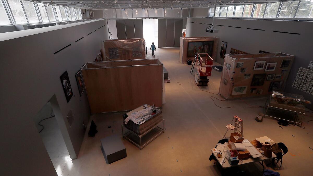 Workers prepare the Wende Museum for its opening in the renovated armory building.
