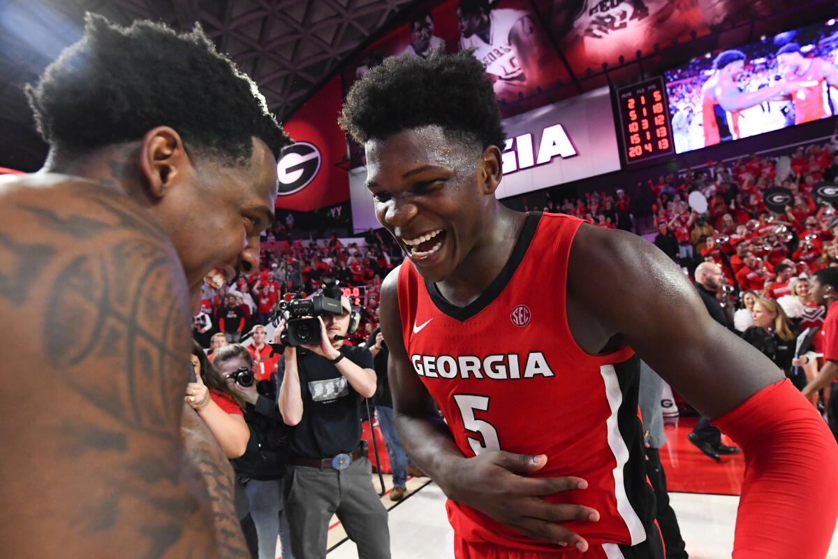 Georgia guard Anthony Edwards, right, and forward Mike Peake celebrate after a win over Auburn in February.