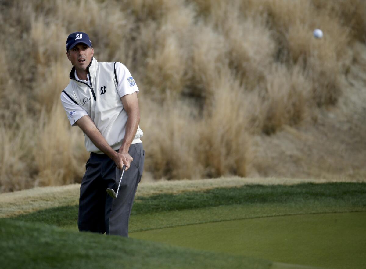 Matt Kuchar watches a chip shot during the second round of the Humana Challenge golf tournament in La Quinta, Calif. Kuchar shot an eight-under-par 64 to take a one-shot lead at 15-under.