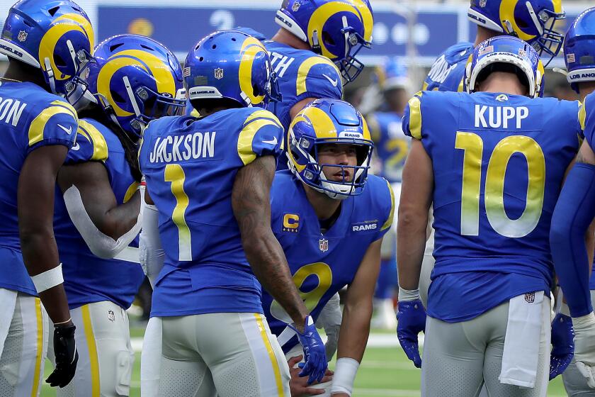 INGLEWOOD, CALIF. - OCT. 24, 2021. Quarterback Matthew Stafford calls a play in the Rams offensive huddle.