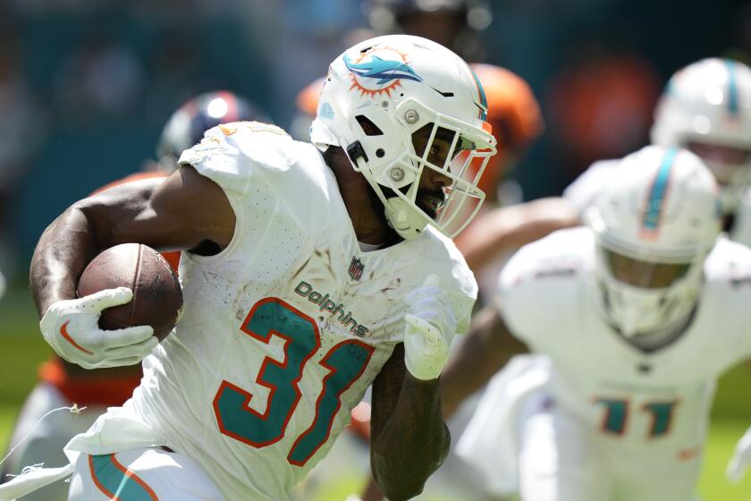 Miami Dolphins running back Raheem Mostert (31) runs for yardage during the first half of an NFL football game against the Denver Broncos, Sunday, Sept. 24, 2023, in Miami Gardens, Fla. The Dolphins defeated the Broncos 70-20. (AP Photo/Wilfredo Lee)