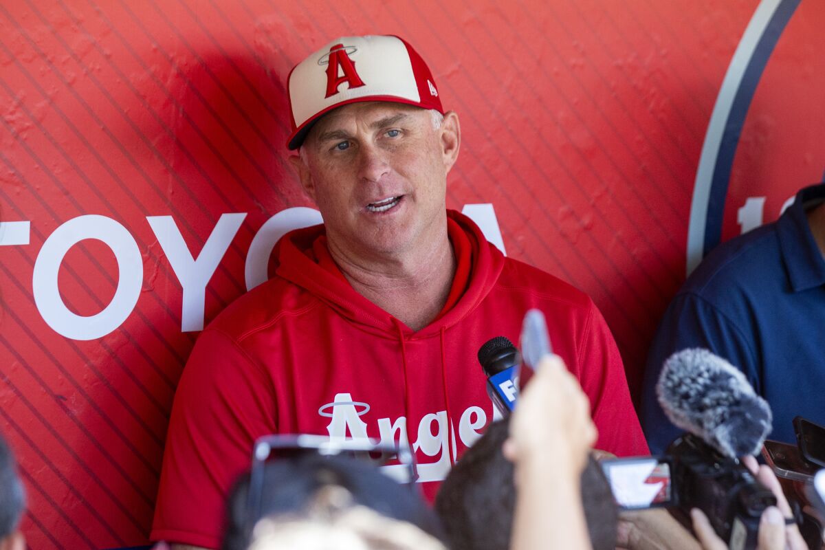 Angels interim manager Phil Nevin speaks to reporters before a game against the New York Mets on June 12.
