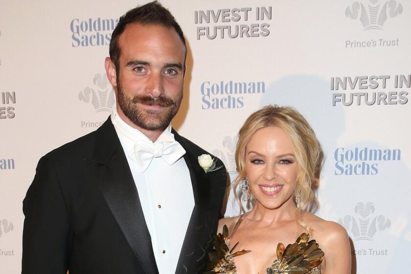Kylie Minogue and boyfriend Joshua Sasse are reportedly engaged. Here, they attend a pre-dinner reception for the Prince's Trust Invest in Futures Gala in London on Feb. 4.