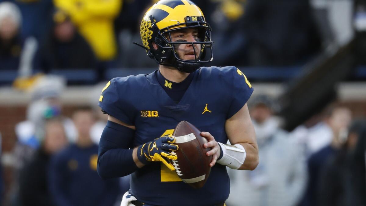 Michigan quarterback Shea Patterson looks to throw a pass against Penn State in November 2018.
